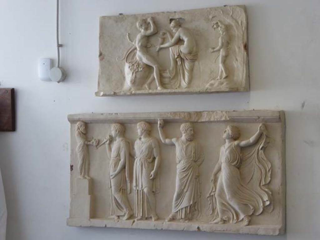 House of Dionysiac Reliefs, Herculaneum. September 2016. Two marble reliefs.
Inventory number 79613 (upper) found in 1997 and inventory number 88091 (lower) found in 2009.
Photo courtesy of Michael Binns.